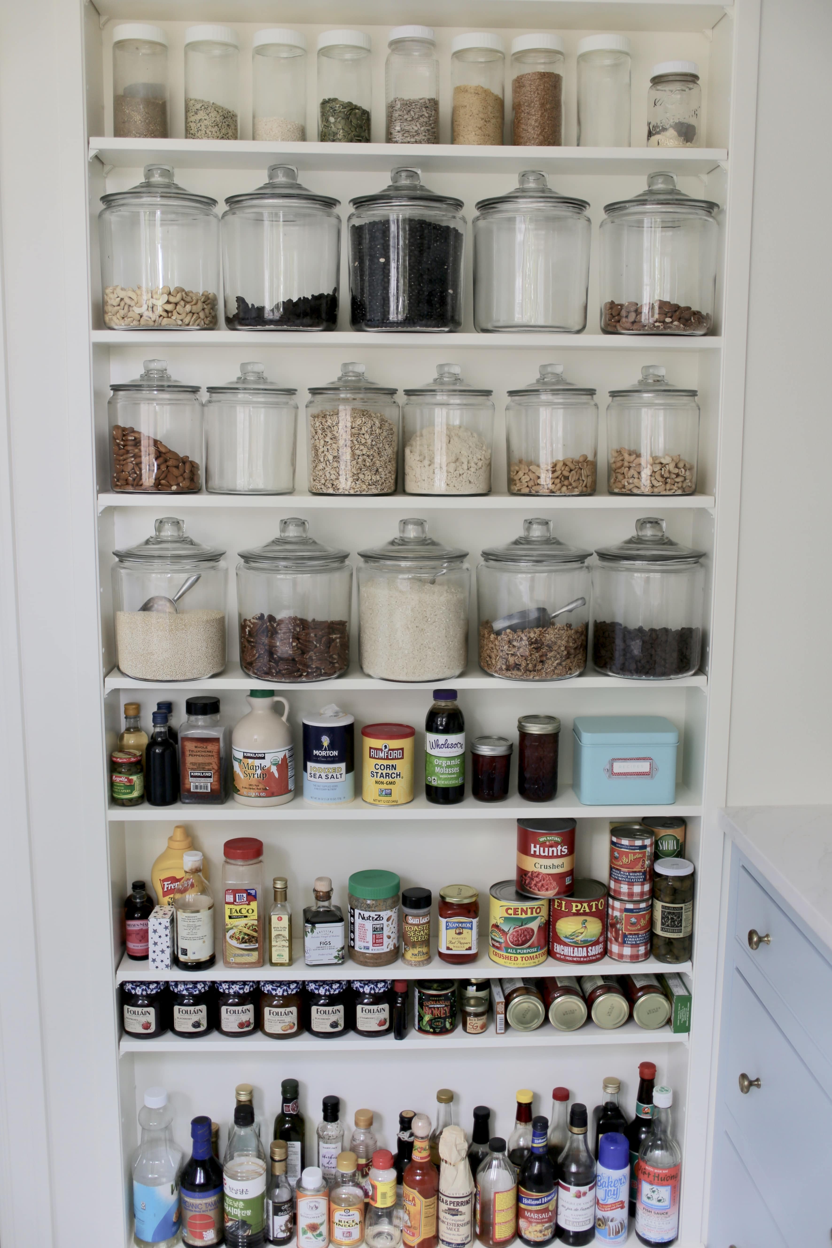 14 Ways To Organize Your Home With Jars- Organizing with jars is an easy way to get your home organized on a budget! Check out all the clever storage solutions you can create with jars! | #organizing #homeOrganization #organization #storageSolutions #ACultivatedNest